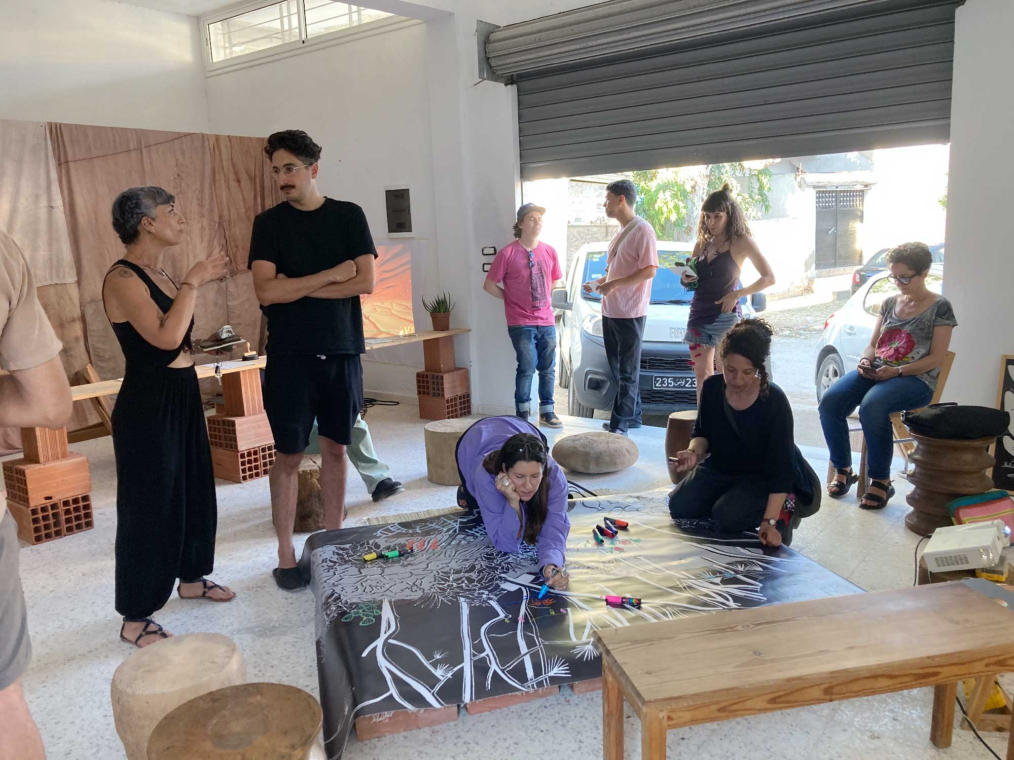 People enjoying our first open studio in Summer 2026.